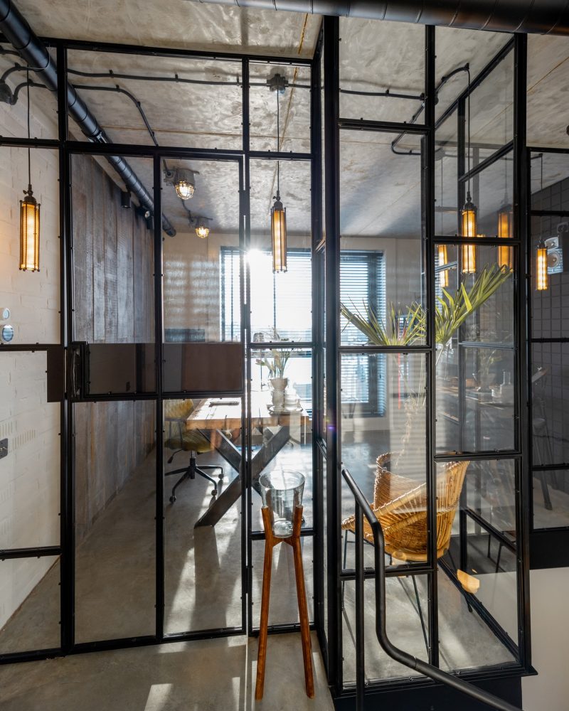 Glass partition to the home office in loft style